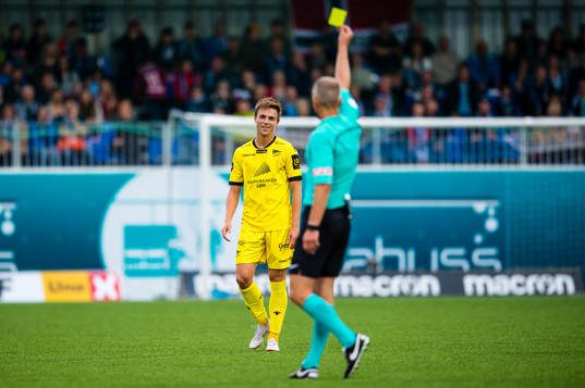 Espen Hammer Berger of Start gets a yellow card