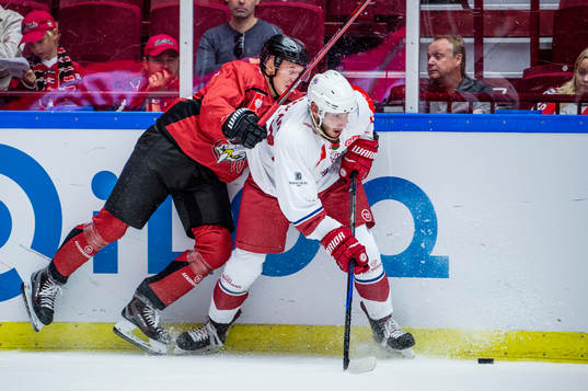 Linus Cronholm of Malmö Redhawks and Vsevolod Kashkar of