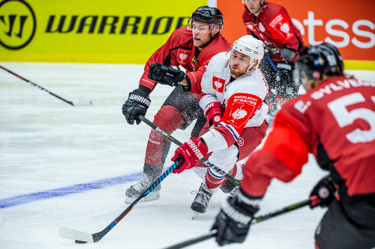 Martin Janolhs of Malmö Redhawks and Stanislav Lopachuk of