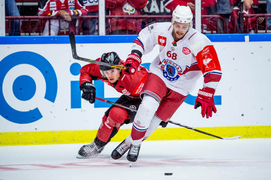 Pavel Kazakevich of Yunost Minsk and Christoffer Forsberg