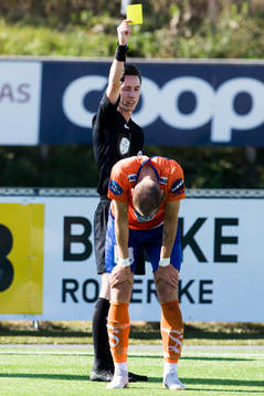 Aron Elís Thrándarson of Aalesund is shown a yellow card