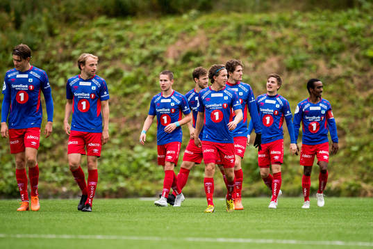 The players of Tromsdalen celebrate the 1-0 goal