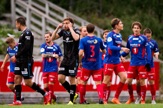 Remi Johansen of Sandnes Ulf reacts while the players of