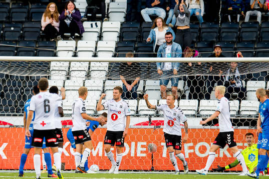 Espen Ruud of Odd celebrates with Birk Risa and teammates