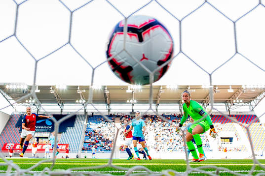 Isabell Herlovsen of Norway scores 2-0 behind goalkeeper