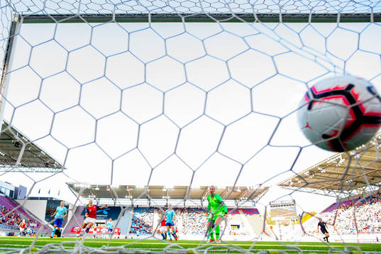 Isabell Herlovsen of Norway scores 2-0 behind goalkeeper