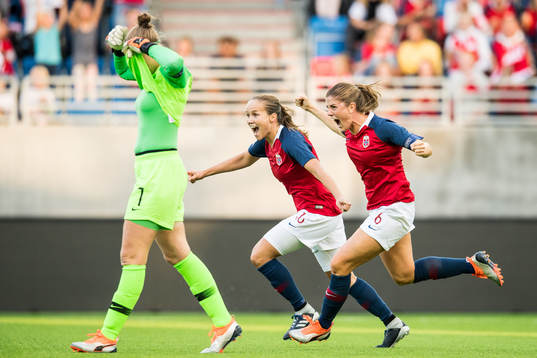 Maren Mjelde and Guro Reiten of Norway celebrate at the