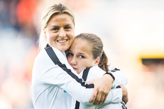 Ingrid Marie Spord and Guro Reiten of Norway celebrate