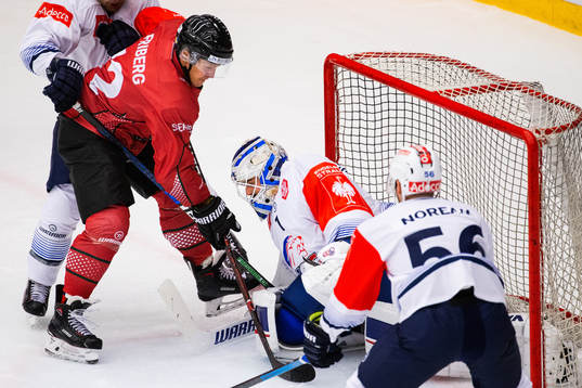 Max Friberg of Frölunda challenges goalkeeper Niklas