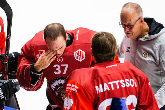 Goalkeeper Johan Gustafsson of Frölunda covers his eye
