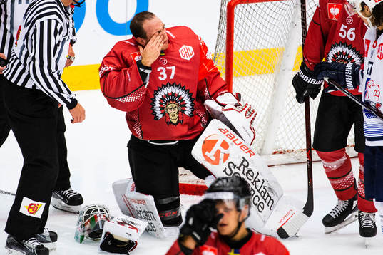 Goalkeeper Johan Gustafsson of Frölunda gets hit by a puck