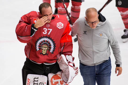 Goalkeeper Johan Gustafsson of Frölunda covers his eye
