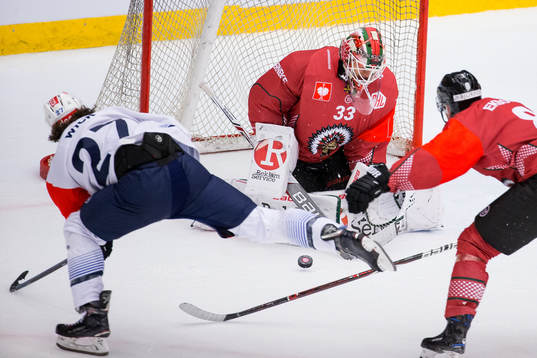 Goalkeeper Johan Mattsson saves a shot from Roman Wick of
