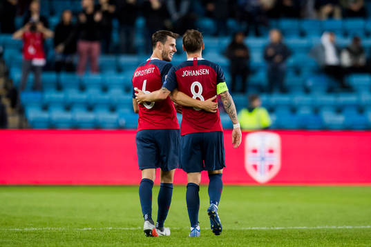 Stefan Johansen of Norway celebrates with his teammate