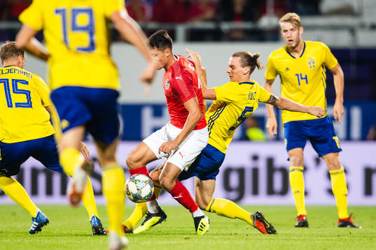 Florian Grillitsch of Austria and Niklas Hult of Sweden