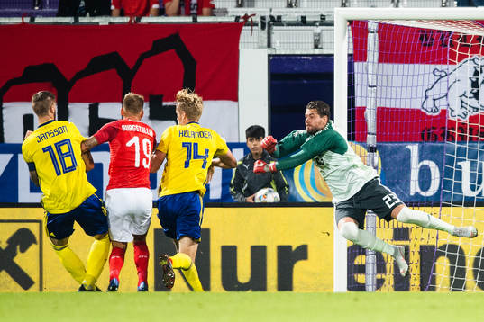 Guido Burgstaller of Austria scores 1-0 behind goalkeeper