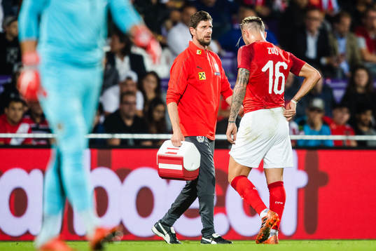 Peter Zulj of Austria leaves the pitch injured