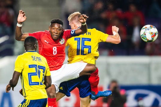 Ken Sema and Emil Krafth of Sweden competes for the ball