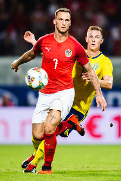 Emil Krafth of Sweden and Marko Arnautovic of Austria