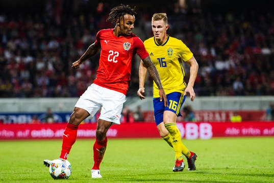 Valentino Lazaro of Austria and Emil Krafth of Sweden