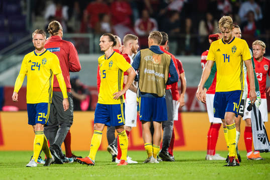 Sam Larsso, Niklas Hult and Filip Helander of Sweden looks