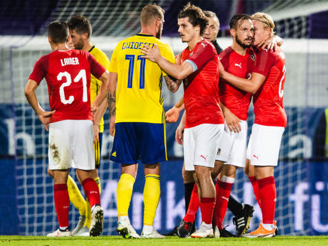 John Guidetti of Sweden among celebrating players of Austria