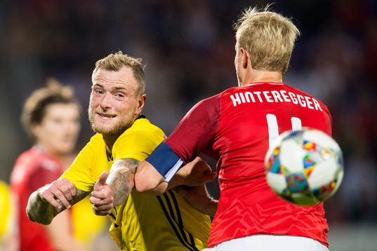 John Guidetti of Sweden and Martin Hinteregger of Austria