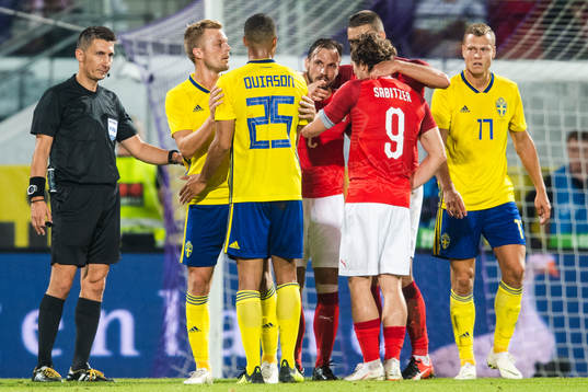 Sebastian Larsson and Robin Quaison of Sweden looks dejected