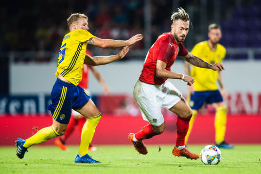 Oscar Hiljemark of Sweden and Peter Zulj of Austria