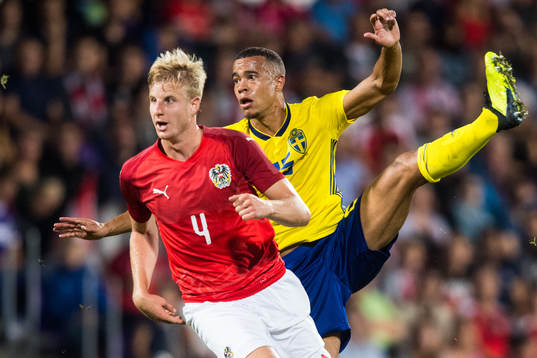 Robin Quaison of Sweden and Martin Hinteregger of Austria