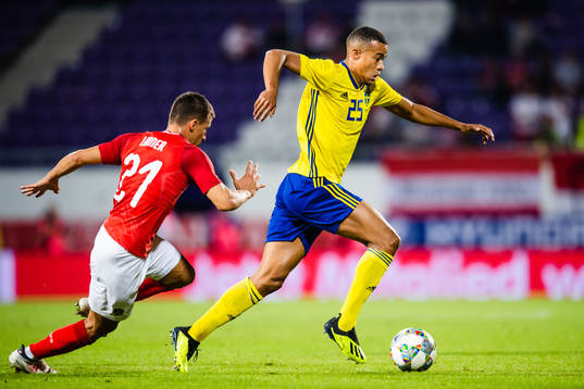 Stefan Lainer of Austria and Robin Quaison of Sweden