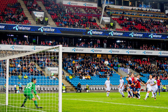 Stefan Johansen of Norway scores 2-0 behind goalkeeper Urko
