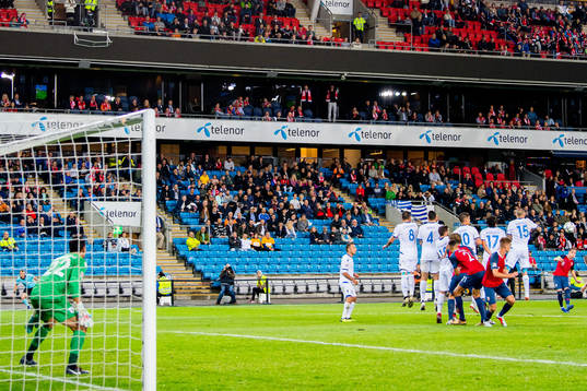 Stefan Johansen of Norway scores 2-0 behind goalkeeper Urko