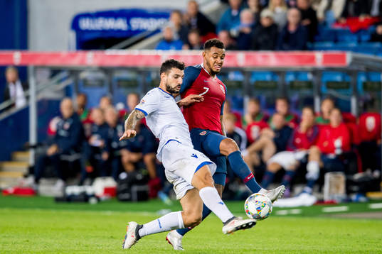 Giorgos Merkis of Cyprus and Joshua King of Norway