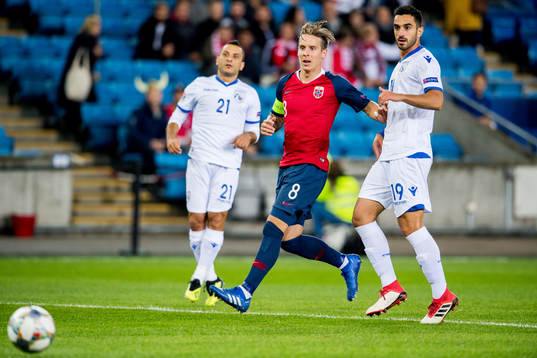 Stefan Johansen of Norway and Kostas Laifis of Cyprus