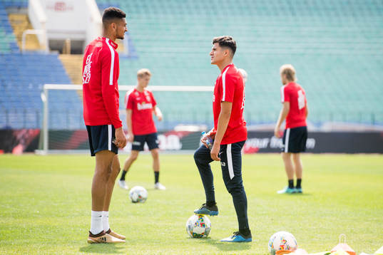 Bjørn Maars Johnsen and Tarik Elyounoussi of Norway