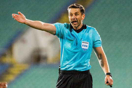 Referee Daniel Stefanski of Poland