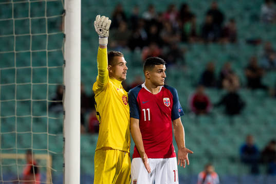Goalkeeper Plamen Iliev of Bulgaria and Mohamed Elyounoussi