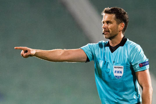 Referee Daniel Stefanski of Poland