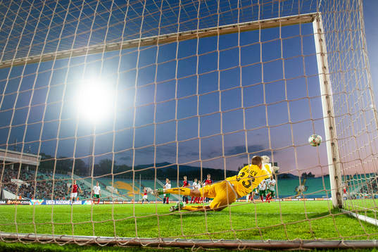 Goalkeeper Plamen Iliev of Bulgaria saves a free kick