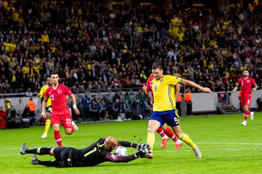 Marcus Berg of Sweden against goalkeeper Sinan Bolat of