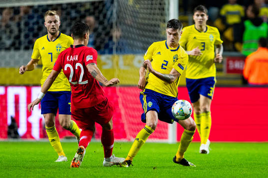Kaan Ayhan of Turkey and Mikael Lustig of Sweden