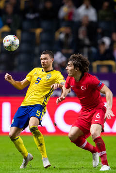 Marcus Berg of Sweden and Caglar Söyuncu of Turkey