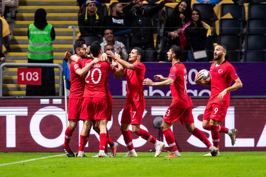 Emre Akbaba of Turkey celebrates with team mate
