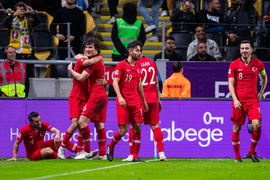 Emre Akbaba of Turkey celebrates with team mates