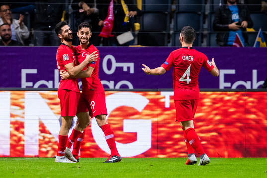 Emre Akbaba of Turkey celebrates with team mates
