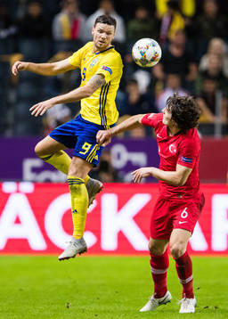 Marcus Berg of Sweden and Caglar Söyuncu of Turkey