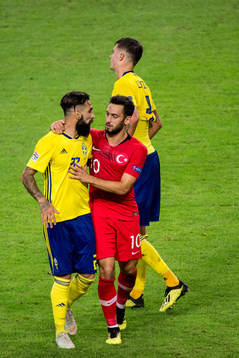 Jimmy Durmaz of Sweden and Hakan Calhanoglu of Turkey