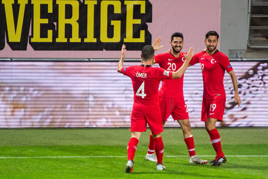 Emre Akbaba of Turkey celebrates with team mates