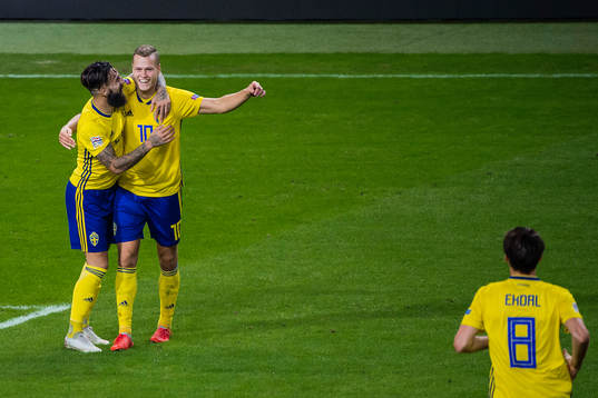 Viktor Claesson of Sweden celebrates with Jimmy Durmaz